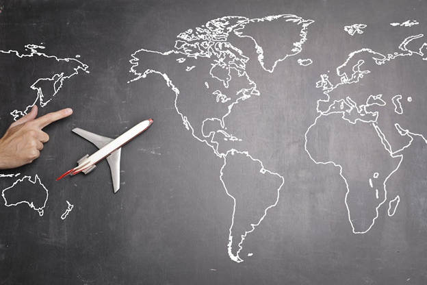 World on a blackboard with an airplane